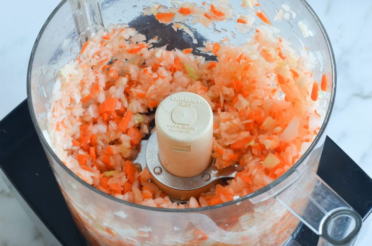 Minced vegetables in a food processor.