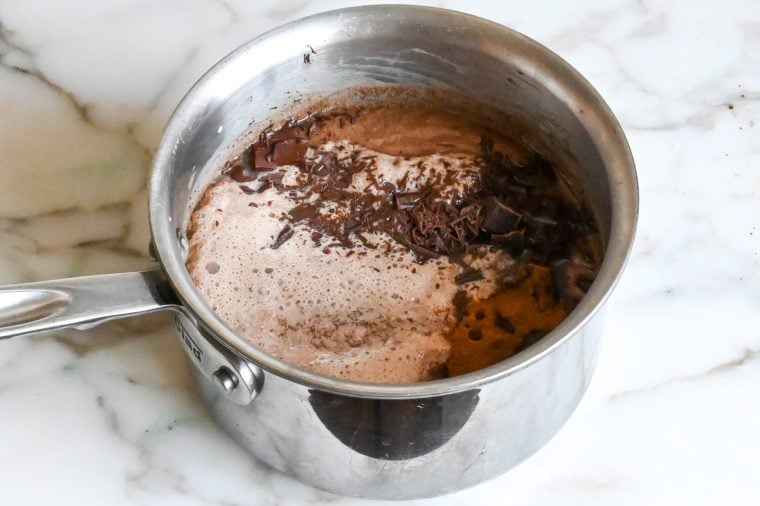 adding the chocolate, bourbon and cinnamon