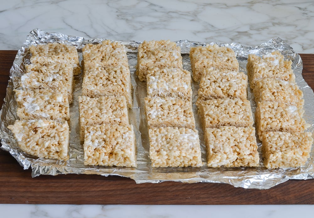 cutting rice krispies treats into squares.