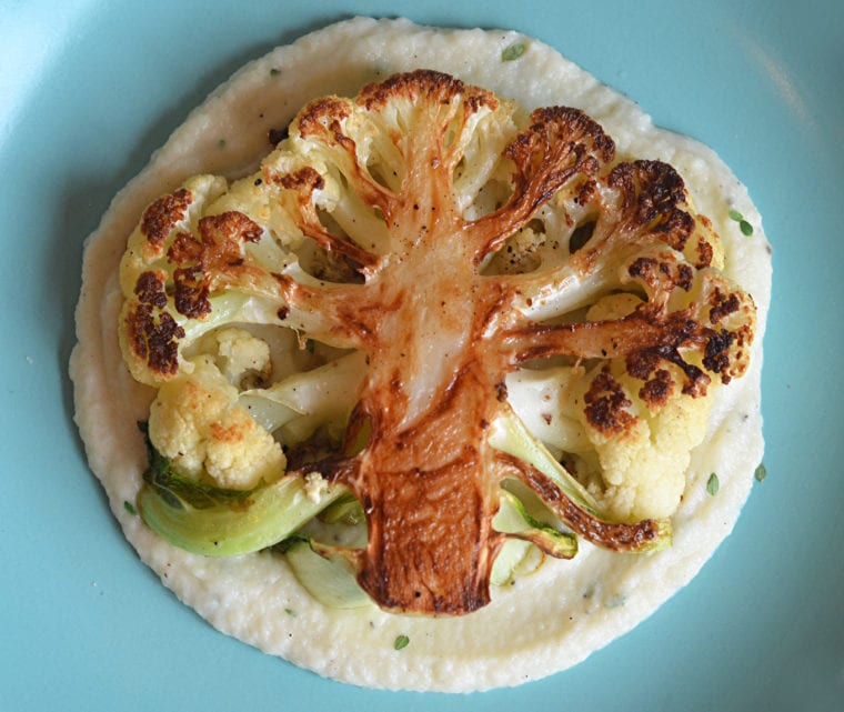 Cauliflower steak on cauliflower puree.