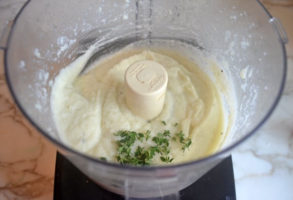 Pureed cauliflower in a food processor.