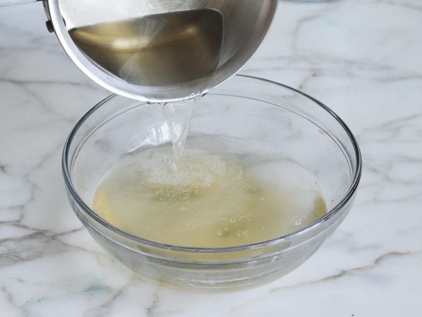 Sugar mixture pouring into gelatin mixture.