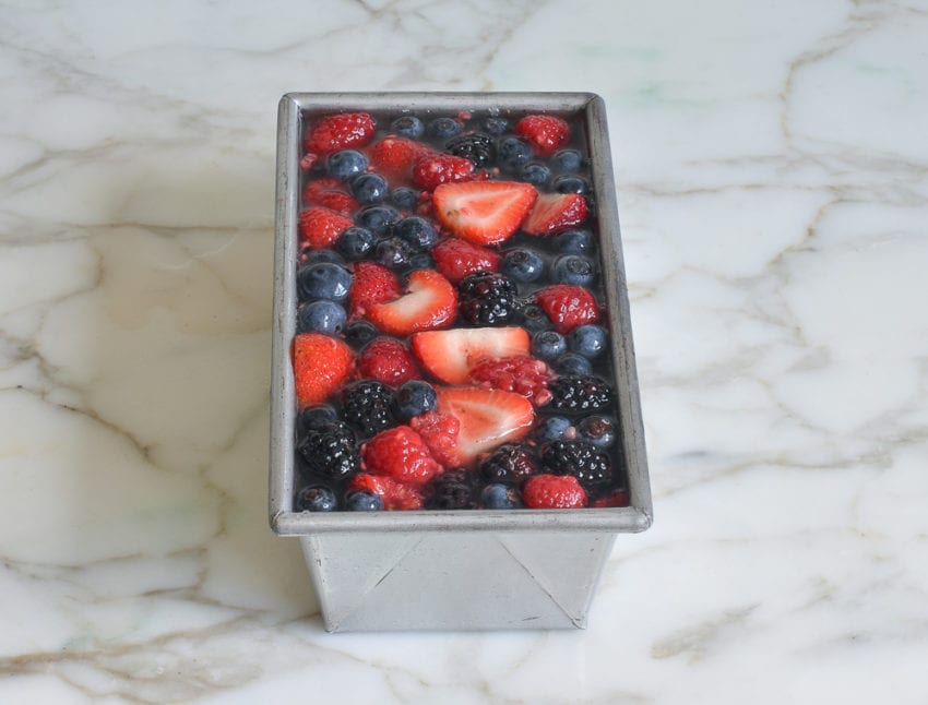 Berries chilling in a pan with gelatin.