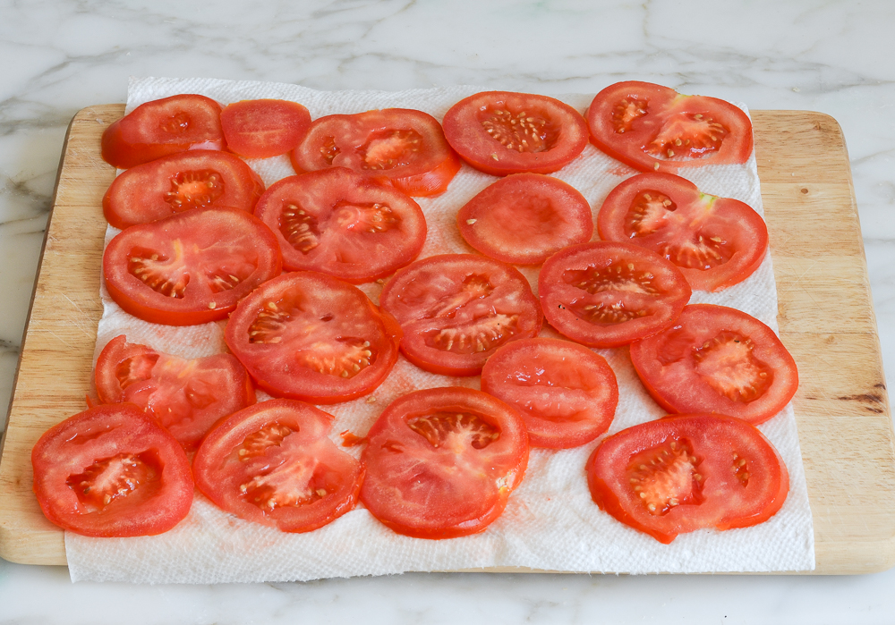 Tomatoes draining on paper towels.