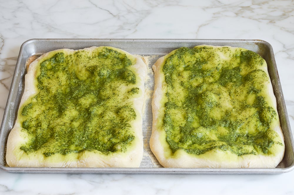 partially cooked pesto pizzas