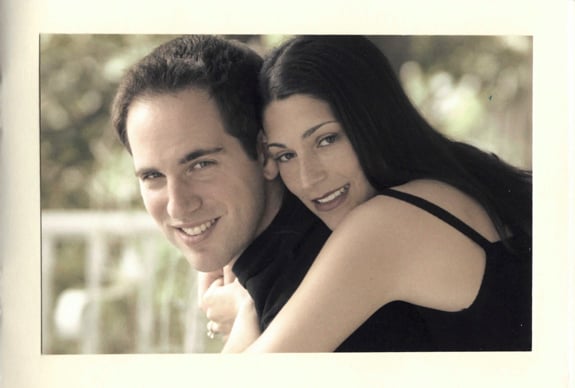 Woman hugging a man.