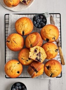 blueberry cornbread muffins cooling on rack