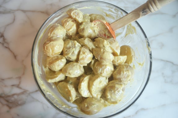Potatoes tossed with sauce.
