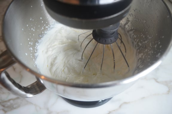 Whipped cream in a stand mixer.