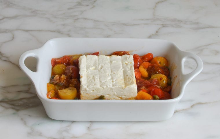 feta and tomato mixture in baking dish