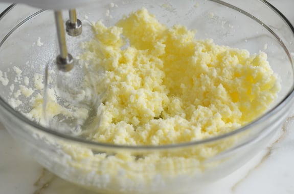 Electric mixer creaming butter and sugar.