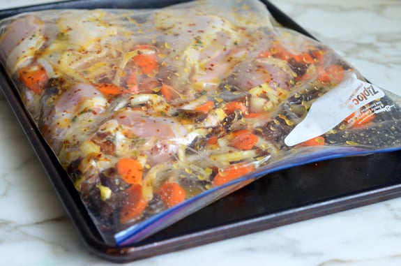Chicken and vegetables in a bag with marinade.