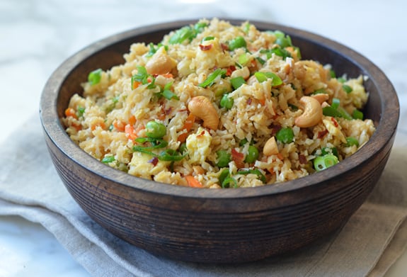 Wooden bowl of cauliflower fried rice.