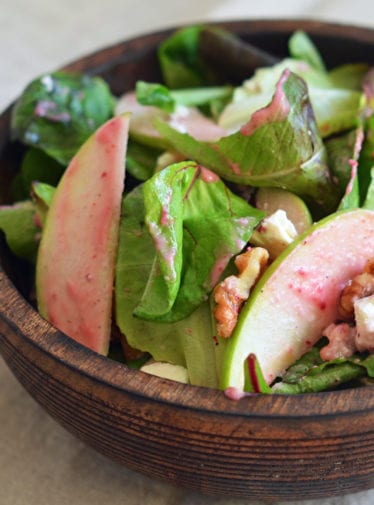 Salad topped with a cranberry Dijon vinaigrette.
