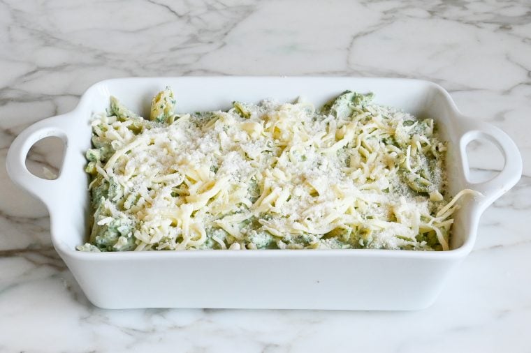 pasta topped with cheese and ready to bake