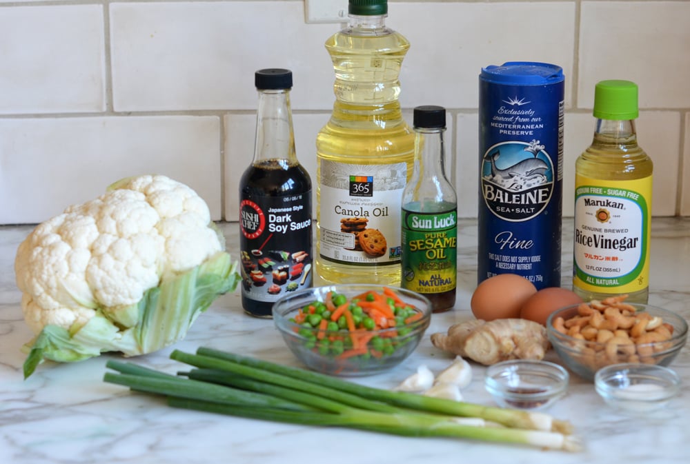 Rice ingredients including cauliflower, dark soy sauce, and sesame oil.