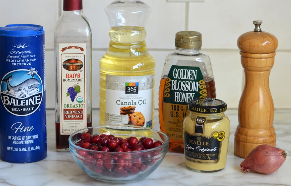 Vinaigrette ingredients including red wine vinegar, honey, and canola oil.