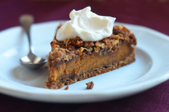 Slice of pumpkin pecan streusel torte on a plate.