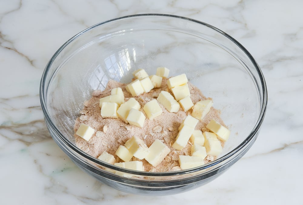 adding butter to streusel