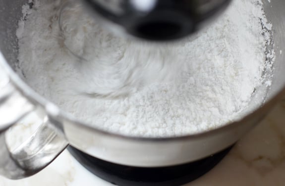 Confectioners sugar in a stand mixer.