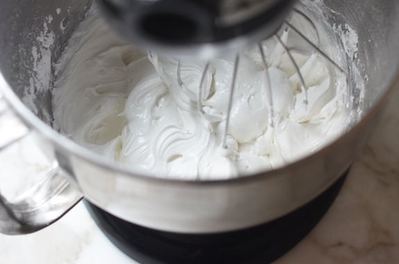 Thick and shiny icing in a stand mixer.