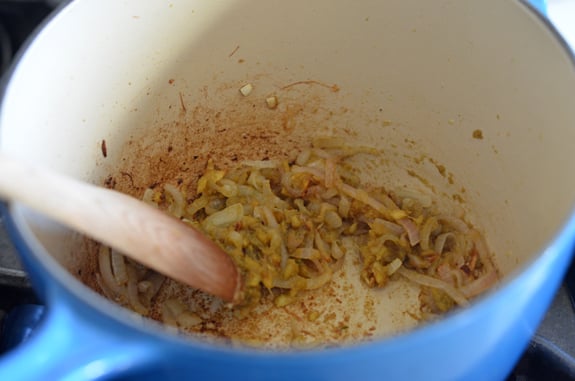 adding green curry paste for thai chicken soup