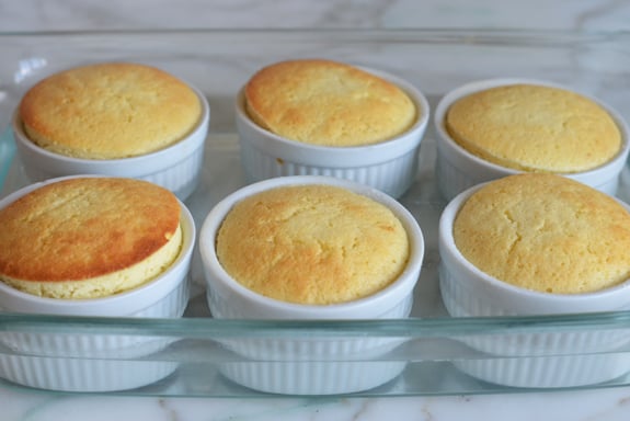 Baked pudding cakes in a baking dish.
