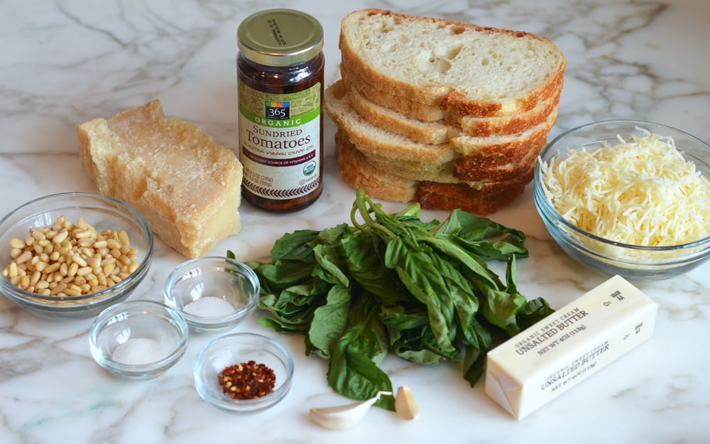 Sandwich ingredients including basil, crushed red pepper, and butter.