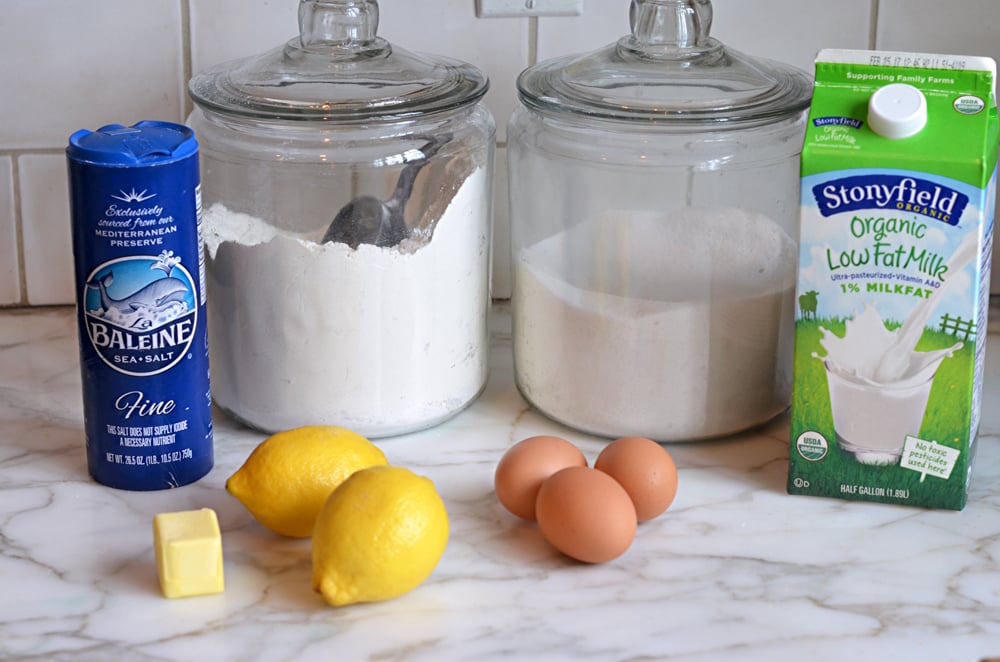 Cake ingredients including lemon, flour, and eggs.