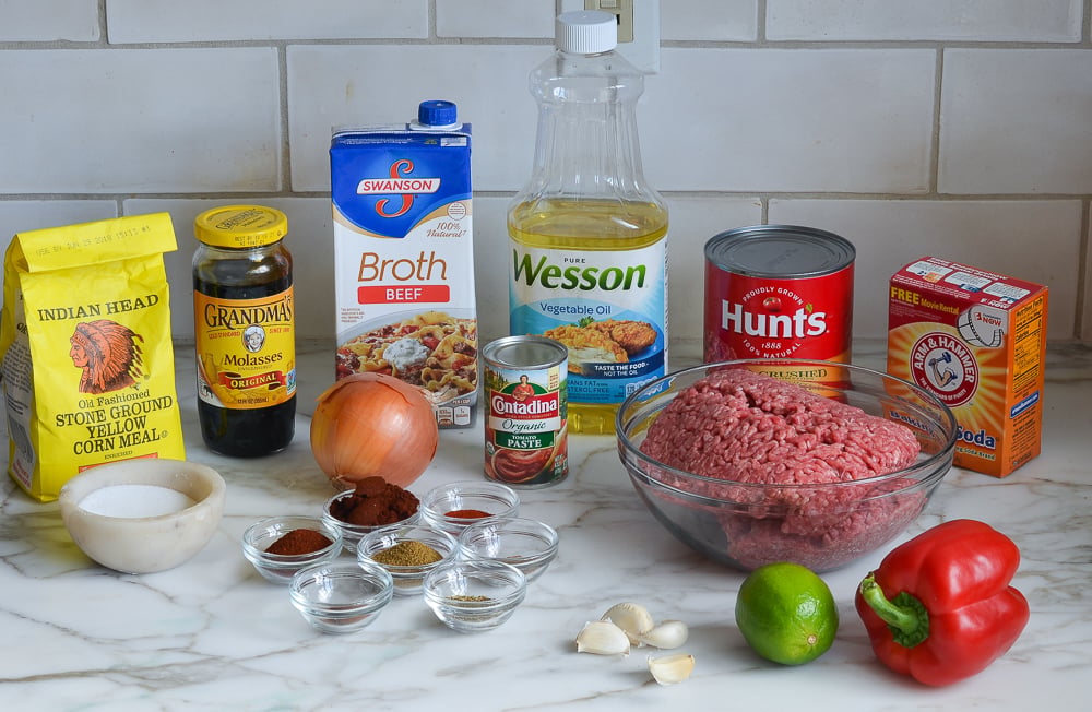 Chili ingredients including beef broth, molasses, and a lime.