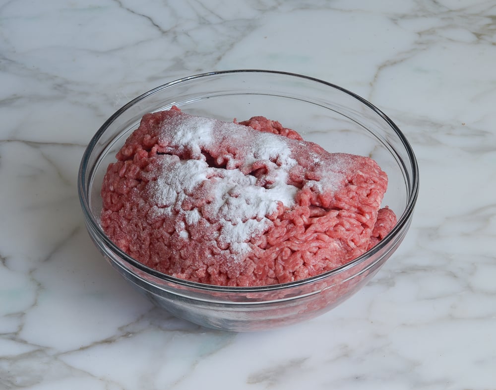 beef, baking soda, salt and water in mixing bowl