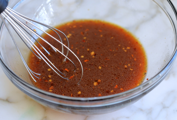 Whisk in a bowl of sauce.