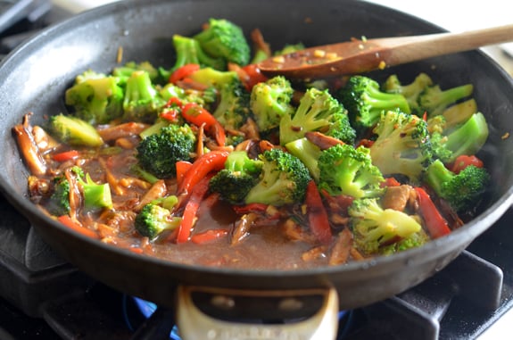 Stir fry sauce in a skillet with vegetables.