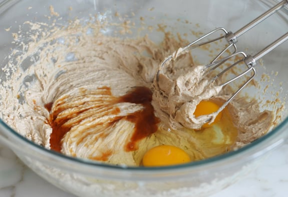 adding eggs to butter and sugar mixture
