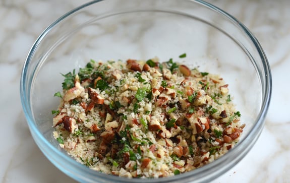 Glass bowl of pecan-parsley-panko mixture.