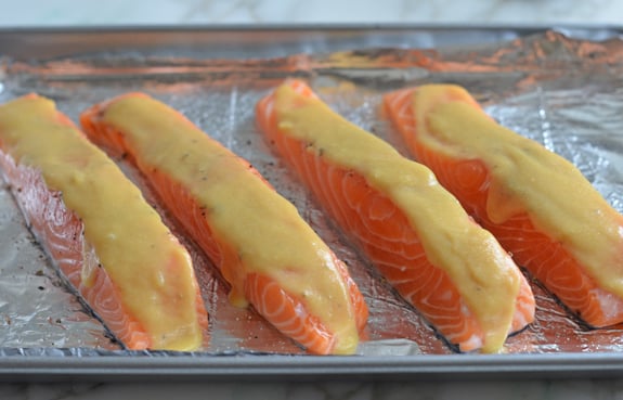 Salmon topped with honey mustard.