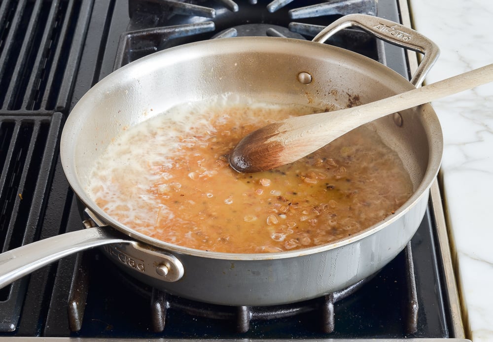Cognac simmering in a skillet.