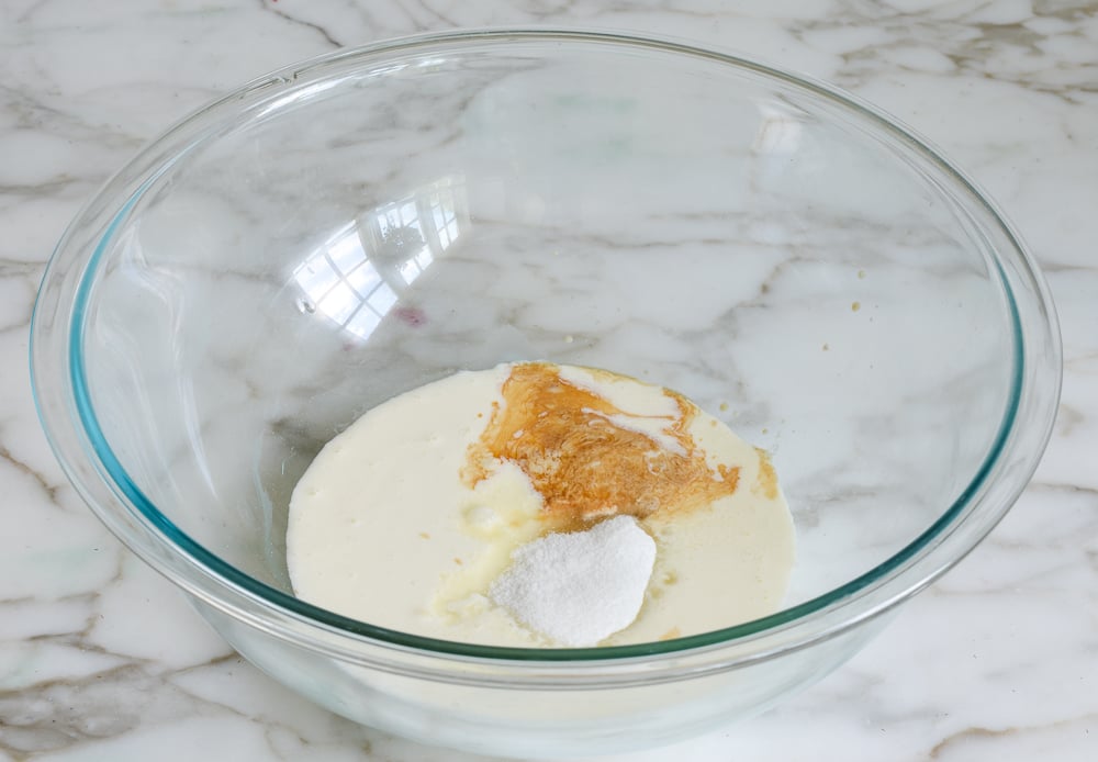 Bowl of sugar, cream, and vanilla.