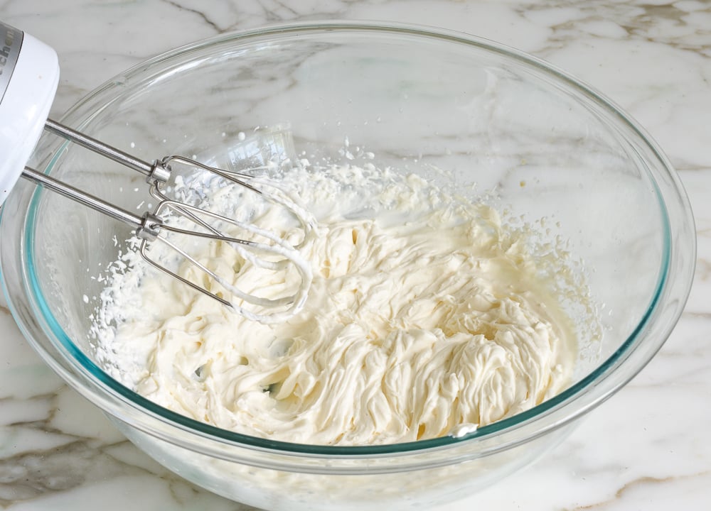 Bowl of cream with stiff peaks.