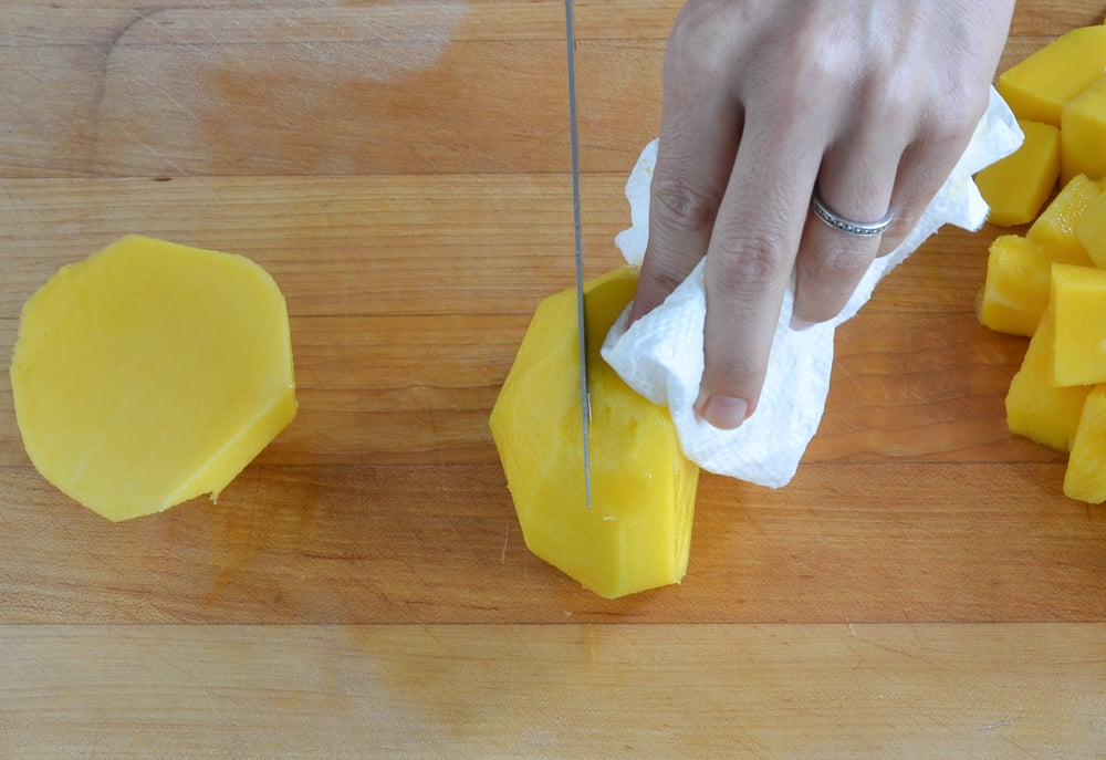cutting other mango cheek off