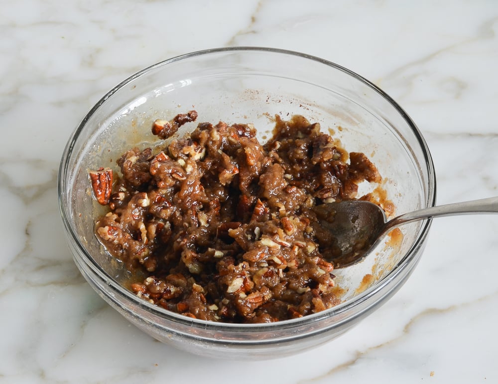Spoon in a bowl of streusel topping.