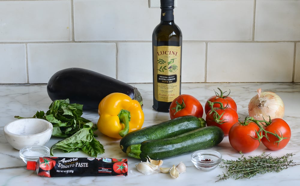 Ratatouille ingredients including tomato paste, zucchini, and bell pepper.