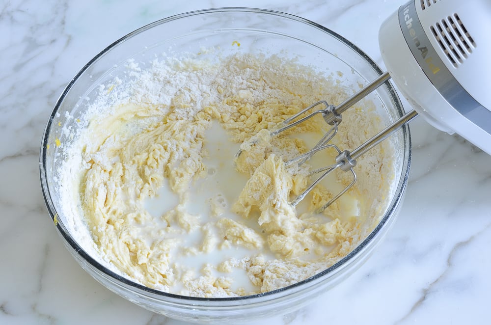 Milk, dry ingredients, and an egg mixture in a bowl.