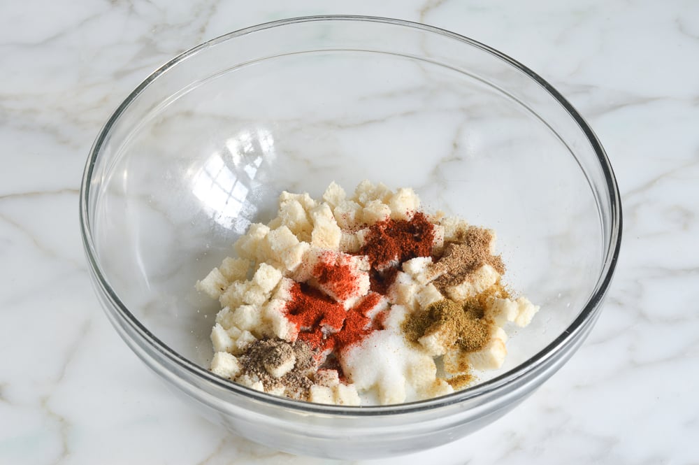 bread, milk, salt, pepper, cumin, coriander, chili powder, smoked paprika, garlic, and Worcestershire sauce in a mixing bowl