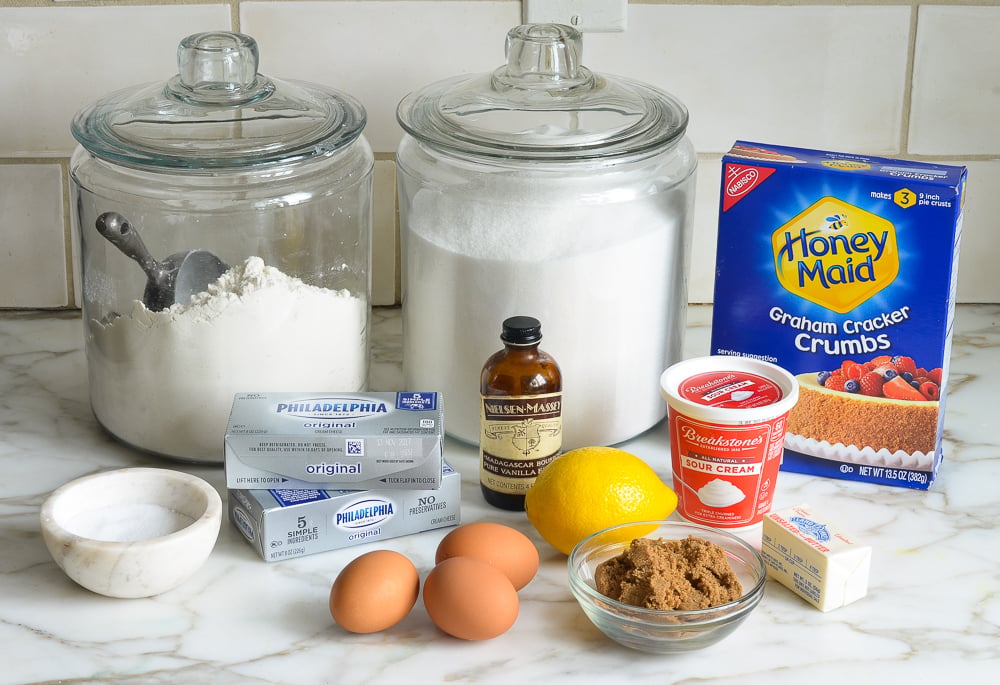 Cheesecake bar ingredients including vanilla, eggs, and cream cheese.