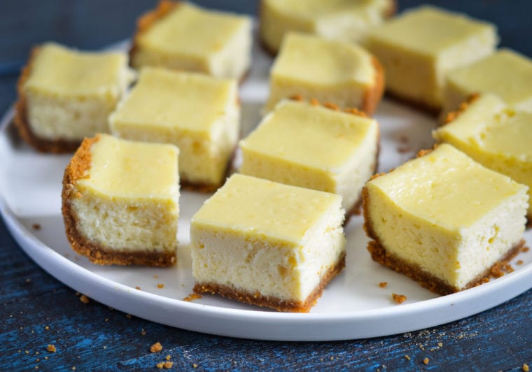 Plate of cheesecake bars.