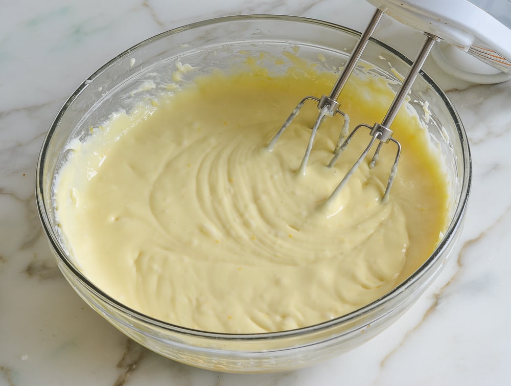 Bowl of beaten egg and cream cheese mixture.