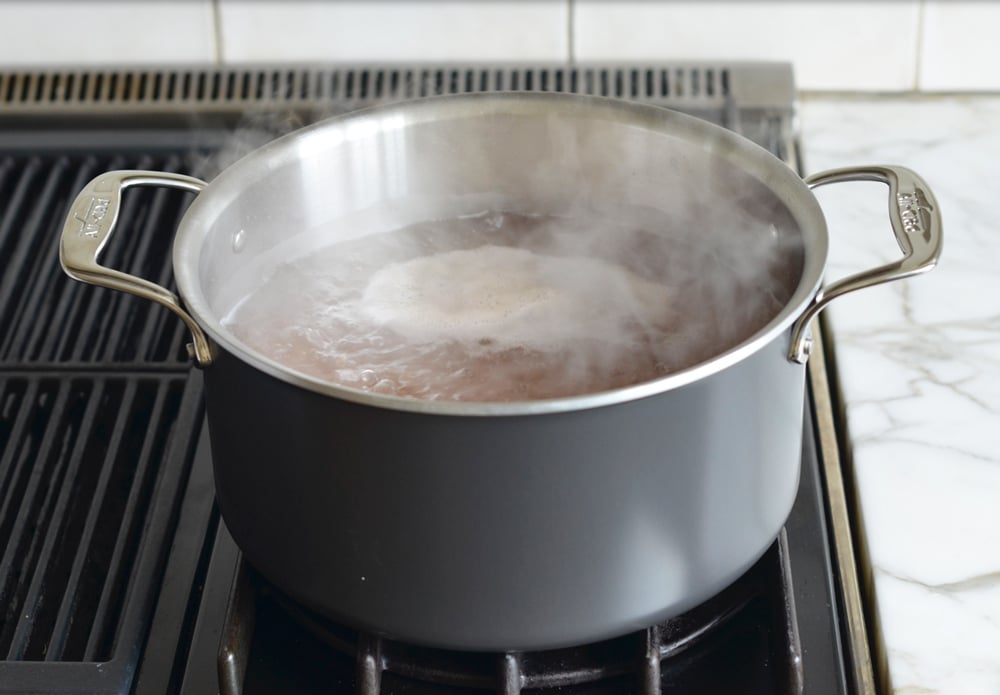 Barley boiling in a pot.