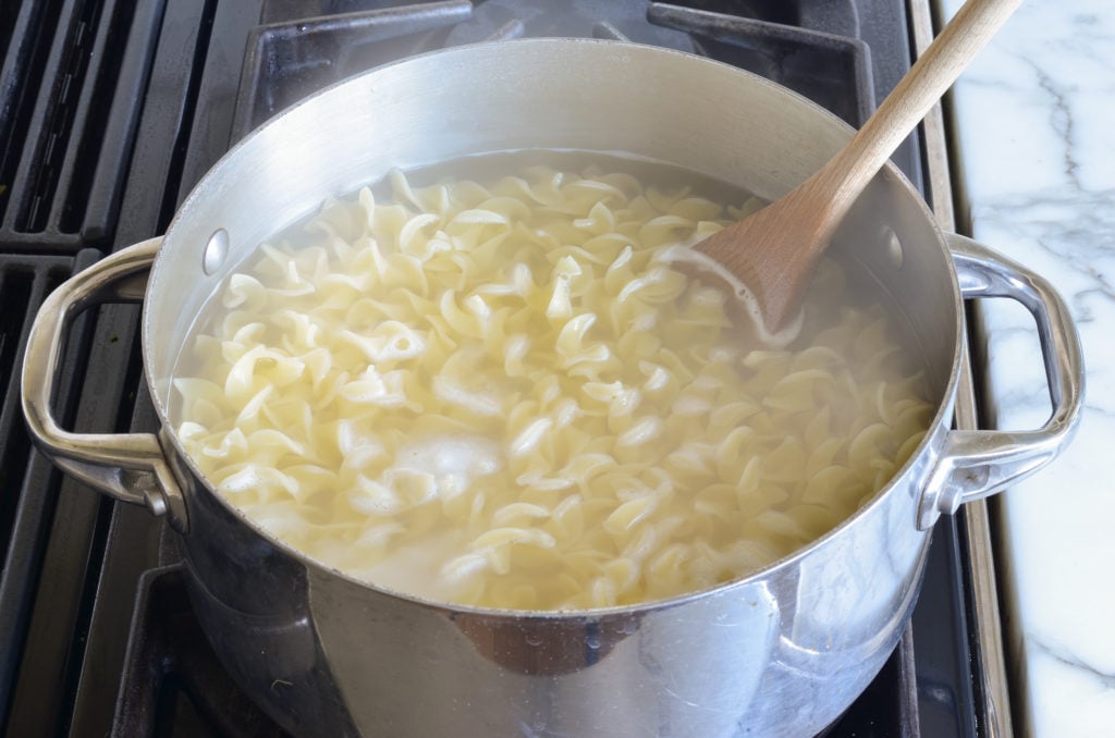 Noodles in a pot of water.