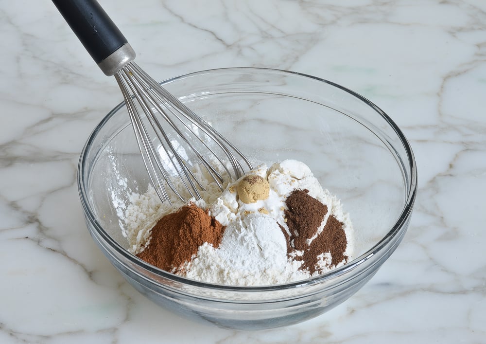 flour and spices for pumpkin pancakes in a bowl